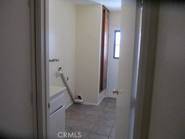 bathroom featuring baseboards, vanity, and tile patterned floors