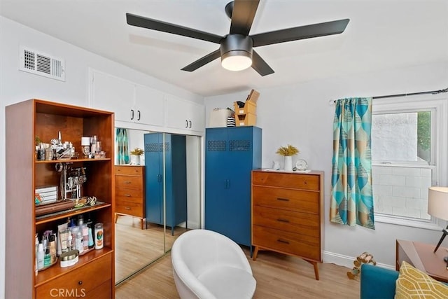 interior space featuring hardwood / wood-style flooring and ceiling fan