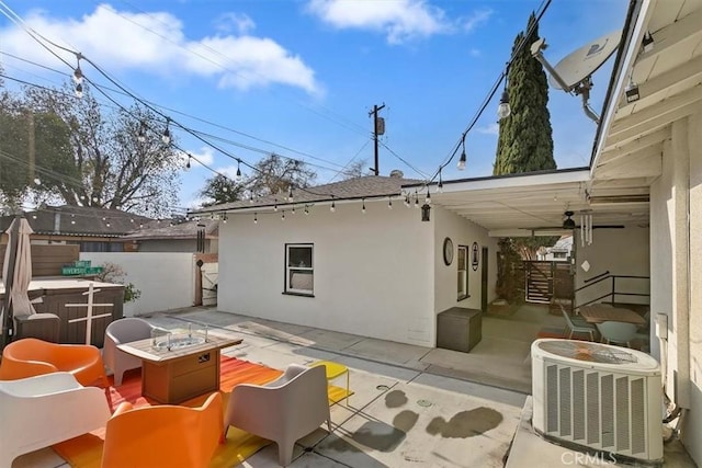 rear view of house with a patio, an outdoor hangout area, and central air condition unit