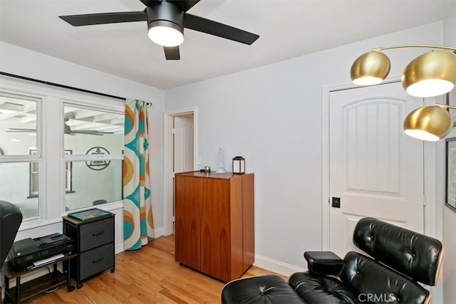 interior space with light hardwood / wood-style floors and ceiling fan