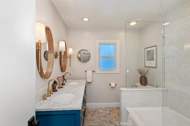 bathroom with tiled shower / bath and vanity