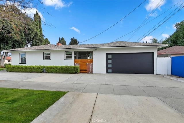 single story home featuring a garage