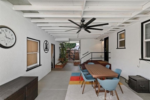 interior space featuring concrete flooring and ceiling fan