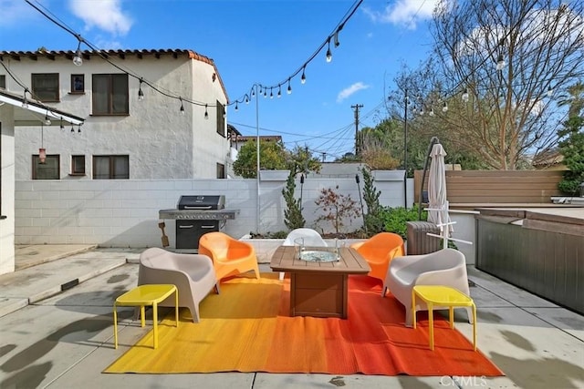 view of patio / terrace featuring grilling area and an outdoor fire pit