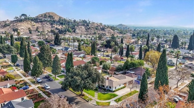 birds eye view of property with a mountain view