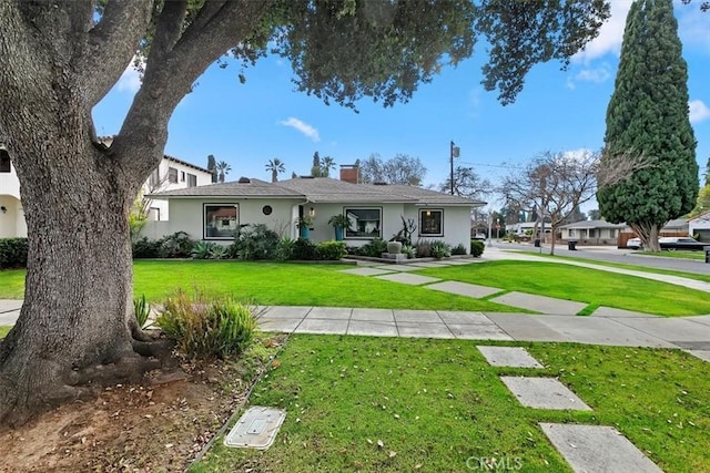 view of front of property with a front lawn