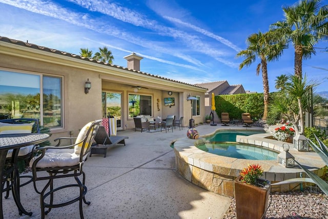 view of pool featuring an in ground hot tub and a patio