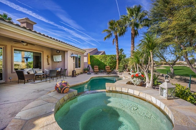 view of pool with an in ground hot tub and a patio area