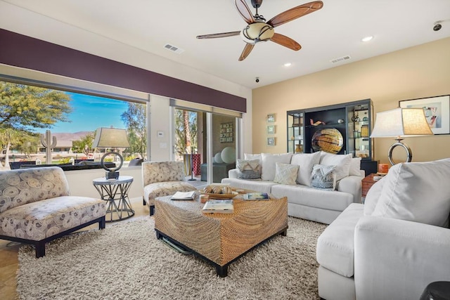 living room featuring ceiling fan