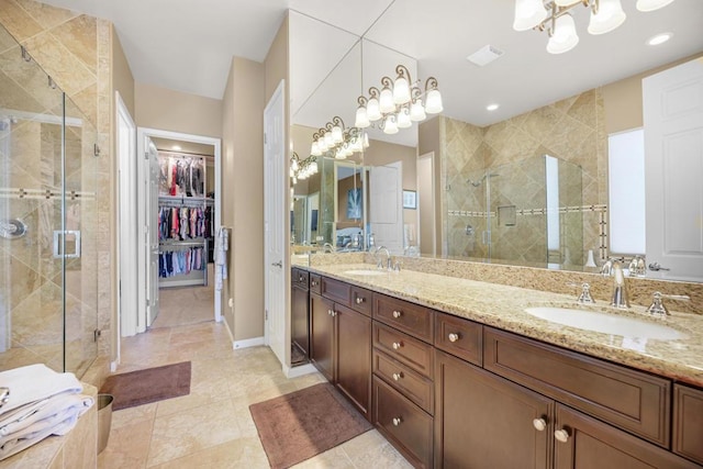 bathroom featuring vanity and a shower with shower door