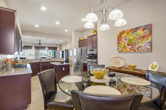 tiled dining area with ceiling fan