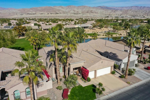 birds eye view of property with a mountain view