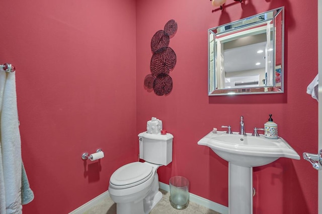 bathroom with tile patterned floors and toilet