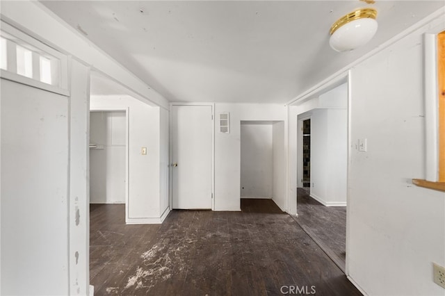 unfurnished bedroom with wood finished floors and visible vents