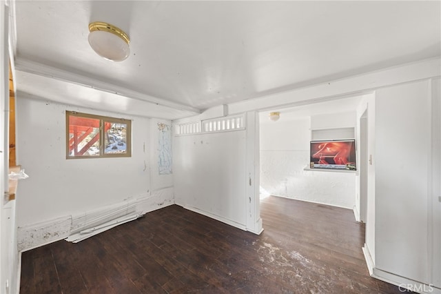 empty room with dark hardwood / wood-style floors