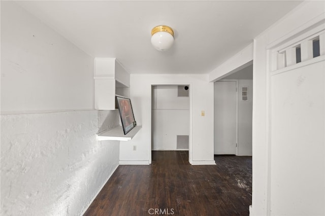 interior space featuring visible vents and dark wood finished floors