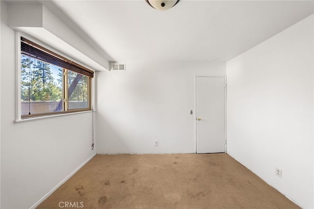 empty room featuring light colored carpet