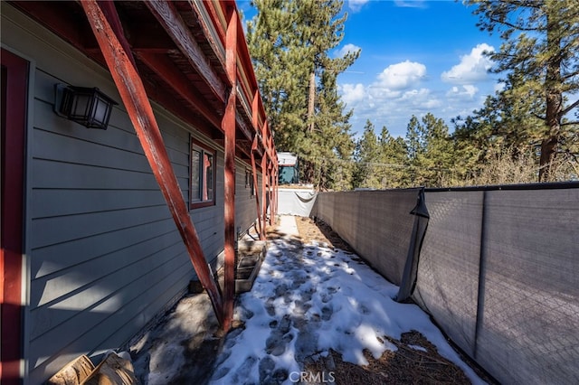 view of home's exterior featuring fence