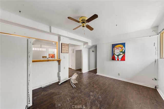 interior space with ceiling fan, baseboards, and hardwood / wood-style floors