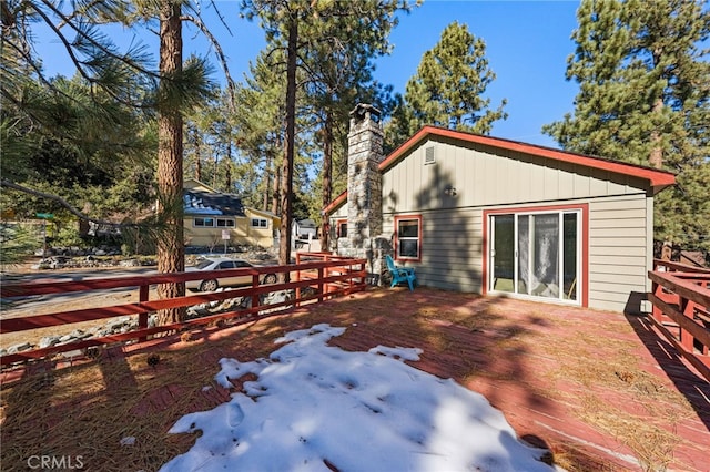 exterior space featuring a chimney