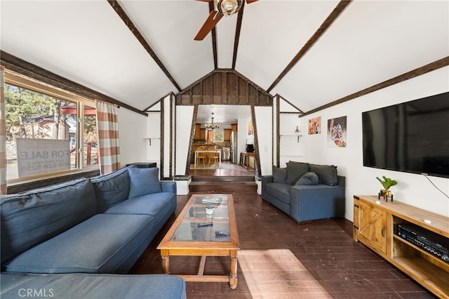 living area with ceiling fan with notable chandelier, lofted ceiling, and wood finished floors