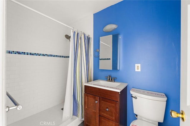 bathroom with vanity, toilet, and a shower with shower curtain