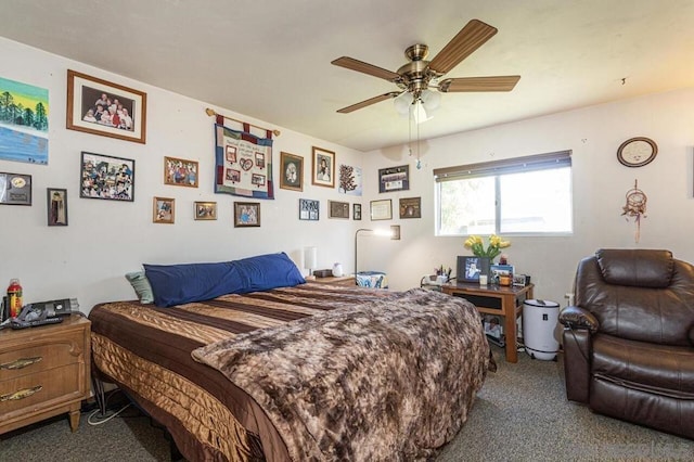 bedroom with dark colored carpet and ceiling fan