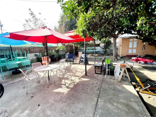 view of patio / terrace with a storage shed