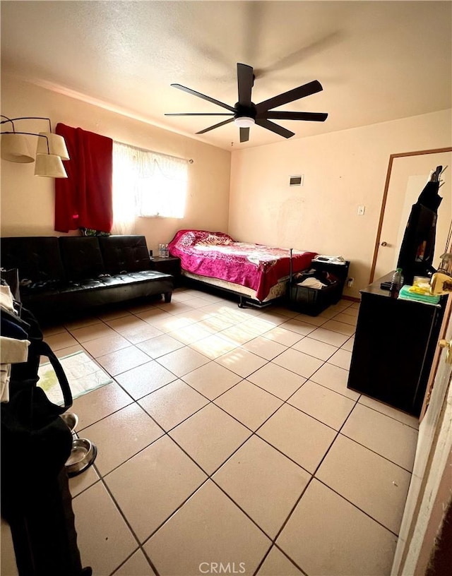 bedroom with light tile patterned flooring and ceiling fan