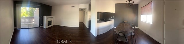 kitchen featuring white cabinetry and dark hardwood / wood-style floors