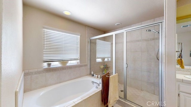 bathroom featuring independent shower and bath and vanity