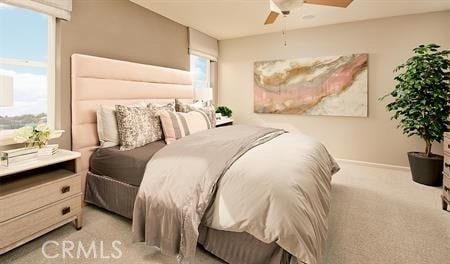 bedroom featuring ceiling fan and light carpet