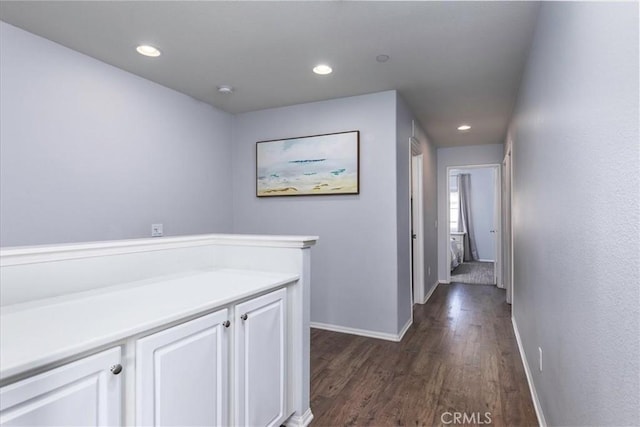 hallway with dark wood-type flooring