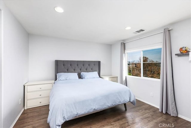 bedroom featuring dark hardwood / wood-style flooring