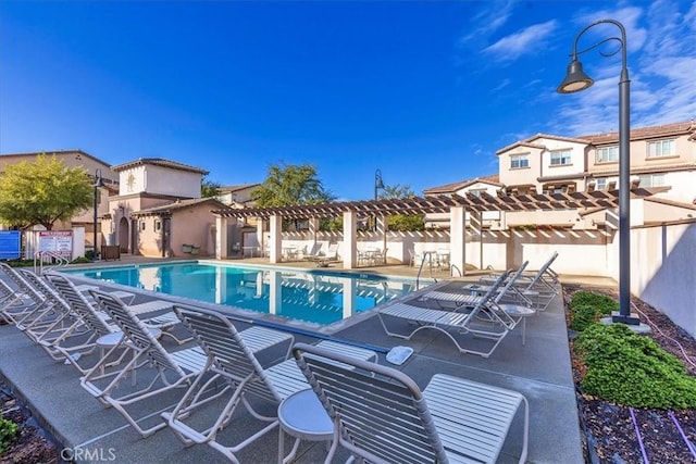 view of pool with a pergola and a patio