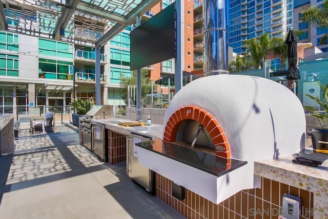 view of patio / terrace featuring an outdoor kitchen