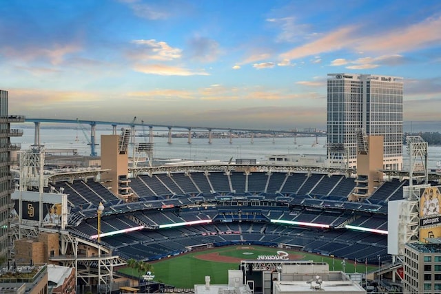 aerial view at dusk featuring a water view