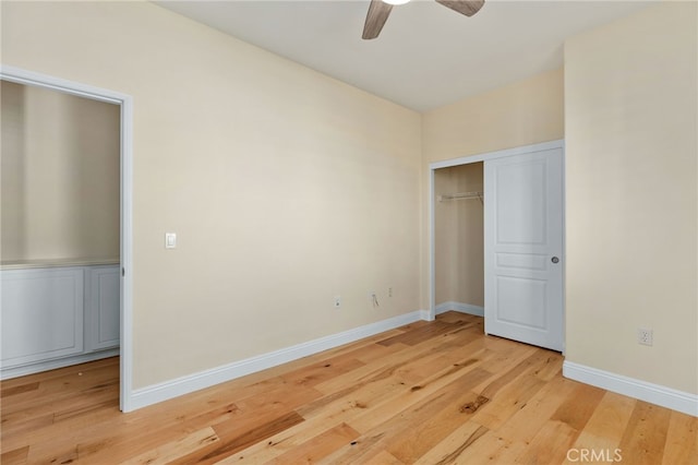 unfurnished bedroom with ceiling fan, a closet, and light hardwood / wood-style flooring