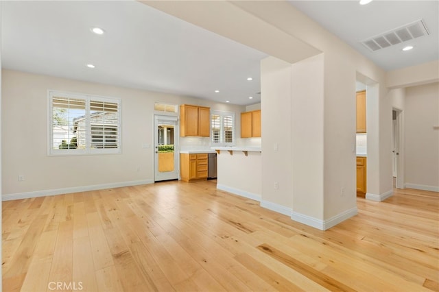 unfurnished living room with light hardwood / wood-style flooring