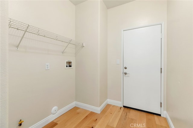 washroom featuring hookup for a washing machine, wood-type flooring, and hookup for a gas dryer