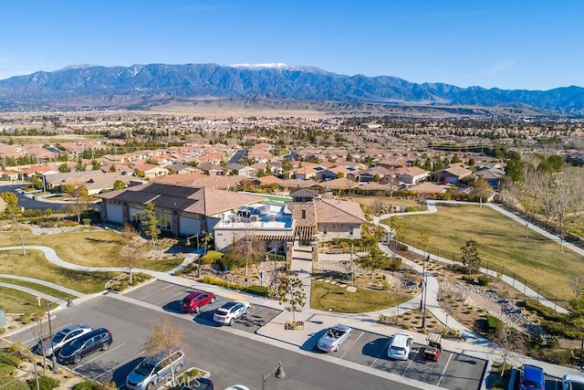 birds eye view of property with a mountain view