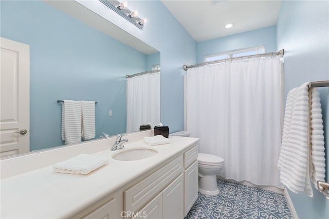 bathroom with vanity, curtained shower, tile patterned floors, and toilet