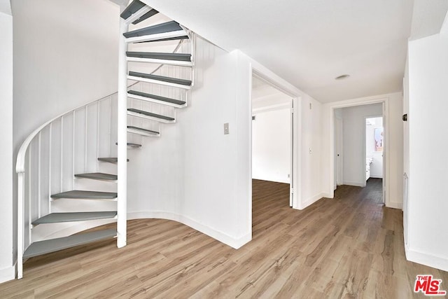 stairway with wood-type flooring