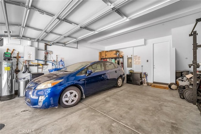 garage featuring electric panel and tankless water heater