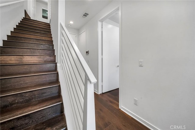 stairs with wood-type flooring