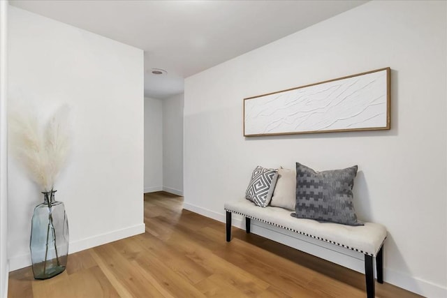 sitting room with hardwood / wood-style flooring