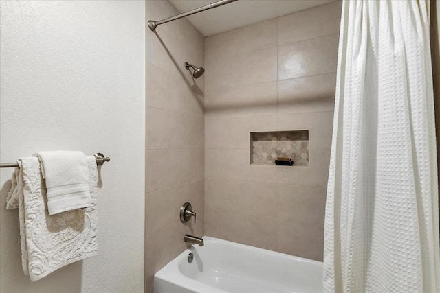 bathroom featuring shower / tub combo with curtain