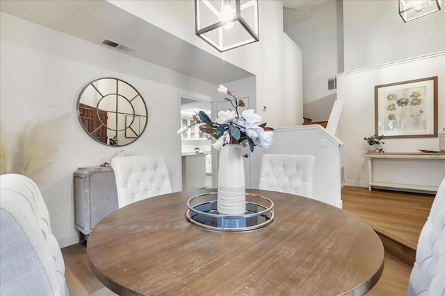 dining space with hardwood / wood-style flooring