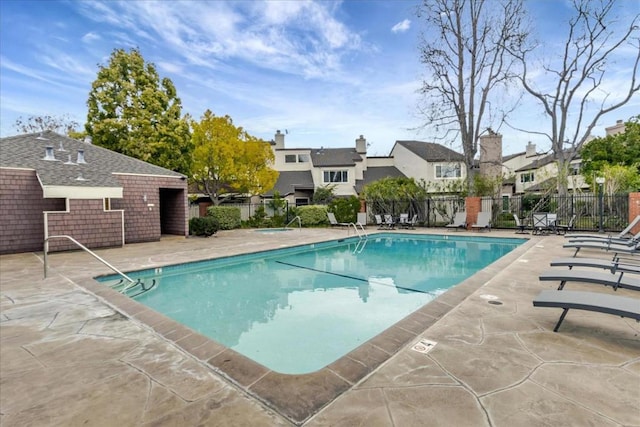 view of swimming pool with a patio