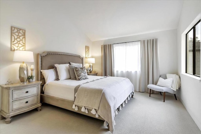 carpeted bedroom featuring vaulted ceiling